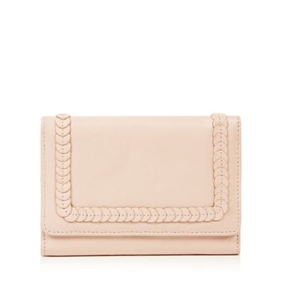 Light pink leather disc applique flapover purse